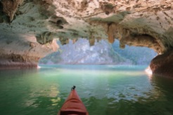 Kayaking through a cave to get to a lagoon